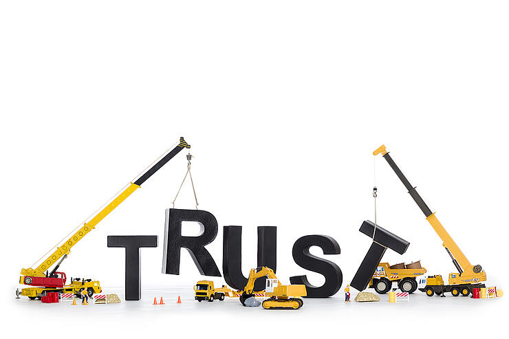 Building up trust concept: Black alphabetic letters forming the