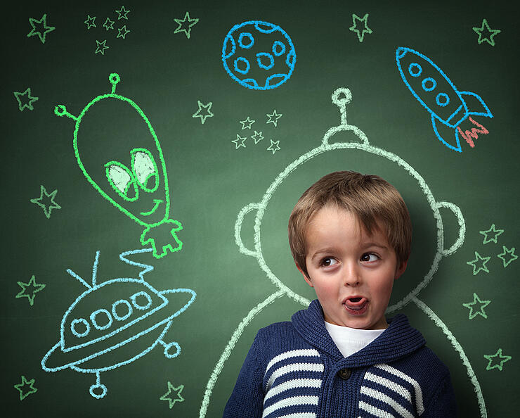 Imagination and dreams of a child, dressed as a space man in fro