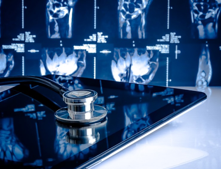 Medical Stethoscope On Modern Digital Tablet In Laboratory On X-