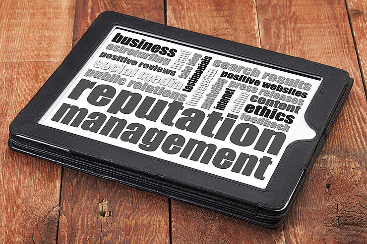 reputation management word cloud on a digital tablet tablet agai