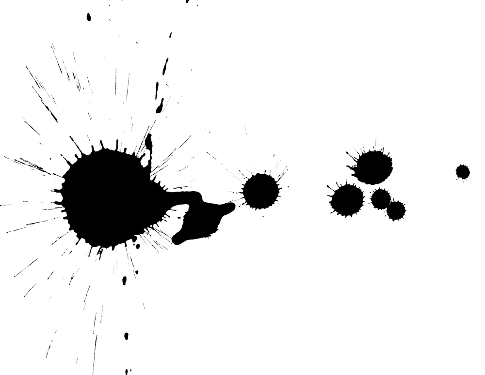 real black ink blot on paper isolated